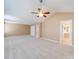 Spacious carpeted bedroom with ceiling fan, ensuite bathroom, and walk in closet at 9684 Ravenscroft Nw Ln, Concord, NC 28027