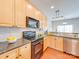 Modern kitchen with stainless steel appliances, granite countertops, and ample cabinet space at 9684 Ravenscroft Nw Ln, Concord, NC 28027