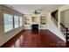 Living room featuring natural light, hardwood floors, and a cozy fireplace at 9684 Ravenscroft Nw Ln, Concord, NC 28027