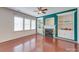 Bright living room features a fireplace, built-in shelving, and large windows for natural light at 9684 Ravenscroft Nw Ln, Concord, NC 28027