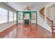 Cozy living room with a fireplace, built-in shelving, and large windows for ample natural light at 9684 Ravenscroft Nw Ln, Concord, NC 28027