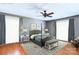 Bright bedroom featuring a four-poster bed, ceiling fan, and neutral decor at 1109 Hemlock Dr, Shelby, NC 28150