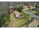 Aerial view of home showcasing large yard, mature trees, and neighborhood at 1109 Hemlock Dr, Shelby, NC 28150