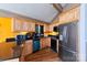 Well-lit kitchen with wooden cabinets, black countertops, and stainless steel appliances at 1109 Hemlock Dr, Shelby, NC 28150