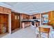 Cozy kitchen features light wood cabinets, black countertops, and tile flooring at 1109 Hemlock Dr, Shelby, NC 28150