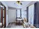 Cozy living room with a door, patterned chair and decorative elements at 1109 Hemlock Dr, Shelby, NC 28150