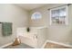 Bright bathroom with a garden tub, tile accents, neutral walls, and natural light from the window at 11122 Windgate Ct, Tega Cay, SC 29708