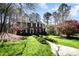 Charming two-story brick home with landscaped front yard and inviting entry for a warm and welcoming appeal at 11122 Windgate Ct, Tega Cay, SC 29708