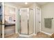 Bathroom with a glass-enclosed shower and tile floors at 11122 Windgate Ct, Tega Cay, SC 29708