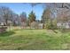 Expansive backyard with lush green grass and mature trees at 12 Roberta Rd, Concord, NC 28027