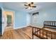 Bright bedroom with hardwood floors and windows bringing in natural light at 12 Roberta Rd, Concord, NC 28027