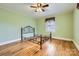 Bedroom featuring ceiling fan, hardwood floors and ample natural light at 12 Roberta Rd, Concord, NC 28027