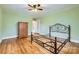 Spacious bedroom with ceiling fan, hardwood floors and wardrobe at 12 Roberta Rd, Concord, NC 28027