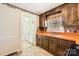 Classic kitchen design with view into laundry area at 12 Roberta Rd, Concord, NC 28027