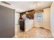 Open kitchen layout with stainless steel refrigerator and natural light at 12 Roberta Rd, Concord, NC 28027