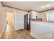 Cozy kitchen featuring stainless steel refrigerator and tile flooring at 12 Roberta Rd, Concord, NC 28027