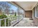 View from the expansive porch showcasing the neighborhood street and greenery at 12 Roberta Rd, Concord, NC 28027