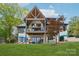 Expansive backyard featuring lush green lawn, outdoor seating, hot tub, and beautiful architecture, perfect for entertaining at 121 Kelly Point Ln, Mooresville, NC 28117