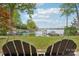 Beautiful view from backyard swing of the lake, showcasing the serene waterfront location and lush greenery at 121 Kelly Point Ln, Mooresville, NC 28117