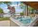 Relax and unwind in this outdoor hot tub, offering stunning lake views and a serene environment for ultimate relaxation at 121 Kelly Point Ln, Mooresville, NC 28117