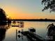 Breathtaking sunset view over the tranquil lake, showcasing the property's serene waterfront location and peaceful atmosphere at 121 Kelly Point Ln, Mooresville, NC 28117
