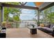 Enjoy the outdoors on this spacious patio, complete with comfortable seating and stunning lake views, ideal for relaxation at 121 Kelly Point Ln, Mooresville, NC 28117