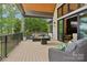 Outdoor patio showcasing stylish seating, lake views, and seamless indoor-outdoor living, ideal for entertaining and relaxation at 121 Kelly Point Ln, Mooresville, NC 28117