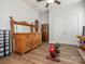 Bedroom featuring wood floors, a ceiling fan and classic wooden furniture at 12432 Bradford Park Dr, Davidson, NC 28036