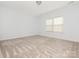 Well lit bedroom with soft carpet and a large window at 12432 Bradford Park Dr, Davidson, NC 28036