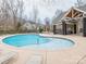 A Community pool featuring lounge chairs and a covered cabana with additional seating at 12432 Bradford Park Dr, Davidson, NC 28036