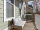 Relaxing front porch featuring comfortable seating, perfect for enjoying quiet moments outdoors at 12432 Bradford Park Dr, Davidson, NC 28036