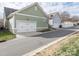 Rear garages on the street, showcasing attached two-car garages and guest parking at 12432 Bradford Park Dr, Davidson, NC 28036