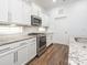 Bright kitchen featuring stainless steel appliances and granite countertops at 12432 Bradford Park Dr, Davidson, NC 28036