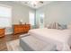 Serene main bedroom featuring a ceiling fan, a window with natural light, and an ensuite bathroom at 12432 Bradford Park Dr, Davidson, NC 28036