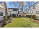 Beautifully landscaped backyard with lush green lawn and manicured garden beds at 1414 Biltmore Dr, Charlotte, NC 28207