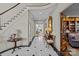 Foyer with marble flooring, staircase, and antique furnishings leading to multiple rooms at 1414 Biltmore Dr, Charlotte, NC 28207