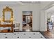 Foyer with marble floors, decorative mirror, and access to a wood-paneled living area at 1414 Biltmore Dr, Charlotte, NC 28207