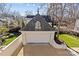 Aerial view of a detached garage featuring a unique roof design and well-kept lawn at 1414 Biltmore Dr, Charlotte, NC 28207