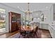 Open concept kitchen and dining area with stainless steel appliances and breakfast nook seating at 1414 Biltmore Dr, Charlotte, NC 28207