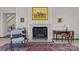 Bright living room featuring a marble fireplace, horse painting, and classic decor at 1414 Biltmore Dr, Charlotte, NC 28207