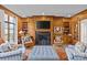 Inviting living room featuring a fireplace, built-in shelves, and comfortable seating, perfect for relaxing at 1414 Biltmore Dr, Charlotte, NC 28207