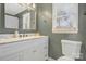 Elegant bathroom featuring a modern vanity, framed mirror, and a bright window for natural lighting at 1417 Shady Bark Dr, Gastonia, NC 28054