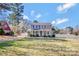 Charming two-story home with a front porch and well-manicured landscaping in the front yard at 1417 Shady Bark Dr, Gastonia, NC 28054