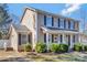 Charming two-story home with a welcoming porch and landscaped front yard at 1417 Shady Bark Dr, Gastonia, NC 28054