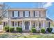 Charming two-story home with a welcoming front porch, manicured landscaping, and a classic architectural design at 1417 Shady Bark Dr, Gastonia, NC 28054