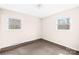 This bedroom is bright with two windows, neutral walls, and carpet flooring at 1502 Northwoods Dr, Kings Mountain, NC 28086