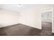 Bedroom with neutral walls and standard carpet, featuring ample lighting at 1502 Northwoods Dr, Kings Mountain, NC 28086