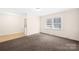 Cozy living room with neutral carpet and natural light at 1502 Northwoods Dr, Kings Mountain, NC 28086