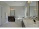 Bright bathroom with tiled floors, dual vanity and a large soaking tub at 17809 Pawleys Plantation Ln, Charlotte, NC 28278