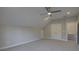 A large bedroom with vaulted ceiling, carpet and double door closet at 17809 Pawleys Plantation Ln, Charlotte, NC 28278